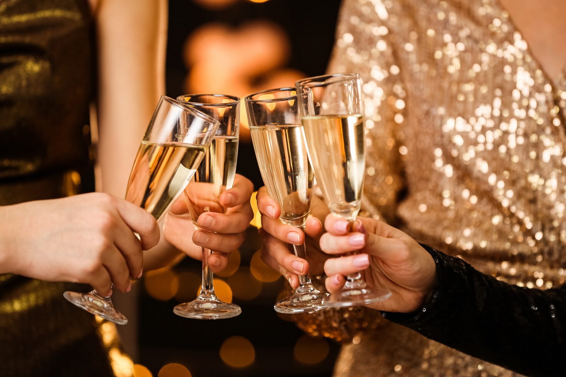 Clinking champagne glasses at a new year's party