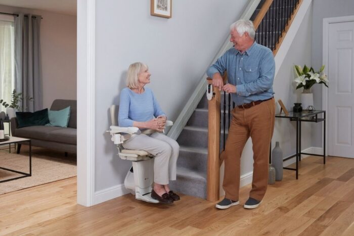 Couple using a stairlift