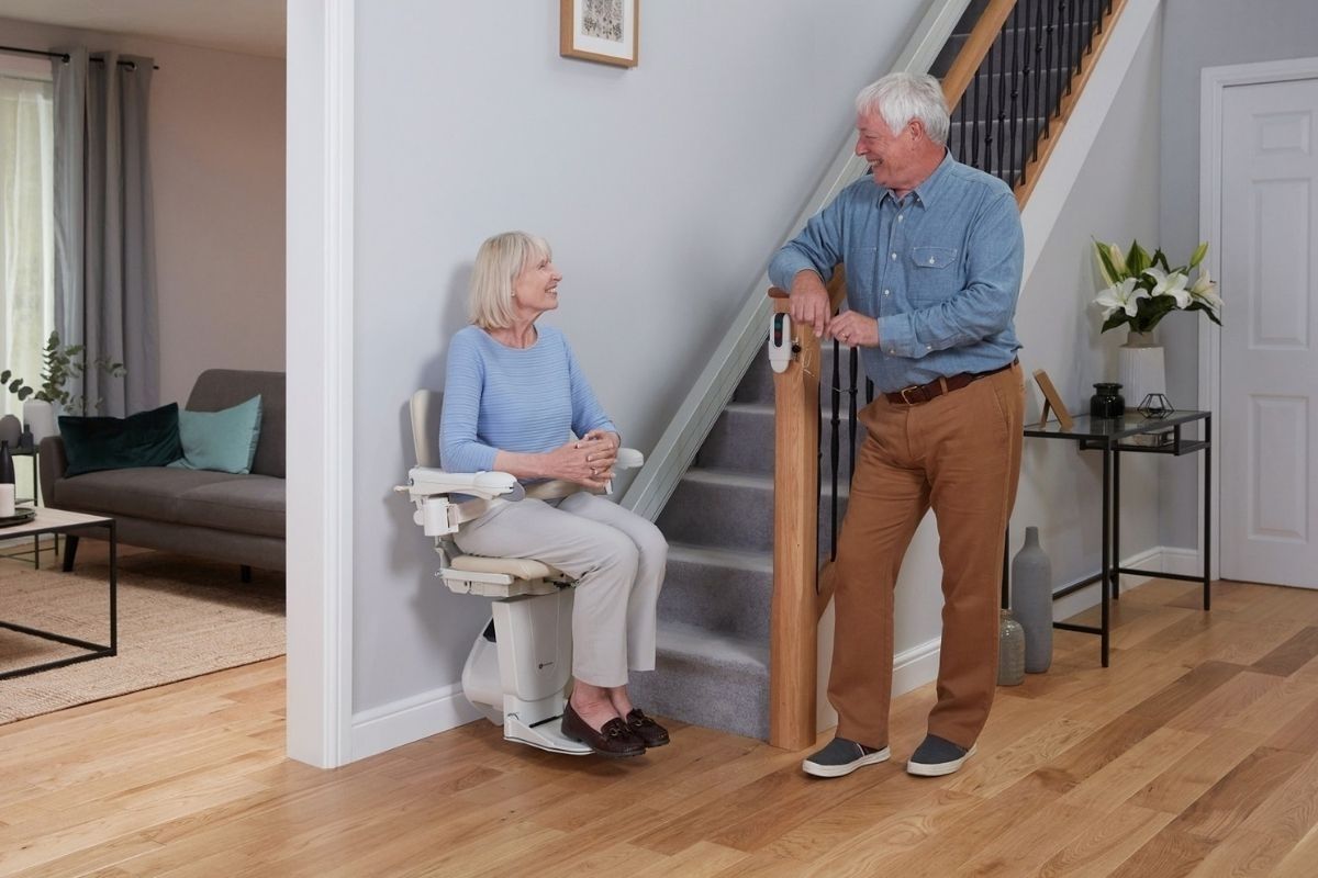 Couple using a stairlift